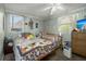 Bright bedroom featuring two windows, a full sized bed, a crib, and dresser at 29 Wendy Lane, Charleston, SC 29407