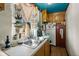 Kitchen featuring wood cabinets, dual basin sink and view from the window at 29 Wendy Lane, Charleston, SC 29407