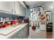 Functional kitchen space with white cabinets, a vintage refrigerator, and essential countertop appliances at 29 Wendy Lane, Charleston, SC 29407