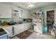 Functional kitchen with white cabinetry, tiled floors, and ample counter space at 29 Wendy Lane, Charleston, SC 29407