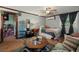 Inviting living room featuring eclectic decor, vintage furniture and wood floors at 29 Wendy Lane, Charleston, SC 29407