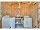Interior shed laundry room including a washer, dryer, and utility cart at 29 Wendy Lane, Charleston, SC 29407