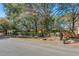 Charming street view of homes with mature trees and well-maintained landscaping at 29 Wendy Lane, Charleston, SC 29407