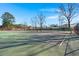 Bright, sunny day on the community tennis court featuring regulation lines and fences at 29 Wendy Lane, Charleston, SC 29407