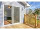 Back deck with wood railing and access to the living room through a sliding glass door at 2901 Newport Pl, North Charleston, SC 29420