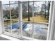 Window view of the lush, green backyard with an in-ground swimming pool at 2901 Newport Pl, North Charleston, SC 29420
