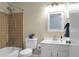 Bathroom with white vanity and a shower-tub combination with brown tiles at 2901 Newport Pl, North Charleston, SC 29420