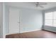 This is a simple bedroom with hard surface floors, blue walls, and a ceiling fan at 2901 Newport Pl, North Charleston, SC 29420