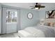 Comfortable bedroom features a ceiling fan, a queen sized bed, and large window at 2901 Newport Pl, North Charleston, SC 29420