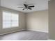 This is a simple bedroom with hard surface floors, neutral walls, and a ceiling fan at 2901 Newport Pl, North Charleston, SC 29420