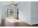 Dining room with a ceiling fan, hardwood floors, and access to a private deck through sliding glass doors at 2901 Newport Pl, North Charleston, SC 29420