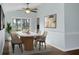 Dining room featuring a modern table set, ceiling fan, and natural light from a sliding glass door at 2901 Newport Pl, North Charleston, SC 29420