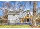 View of the two-story house exterior showcasing a wooden deck and fenced backyard at 2901 Newport Pl, North Charleston, SC 29420