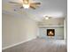 Bright living room with stone fireplace, ceiling fan, and sliding glass doors at 2901 Newport Pl, North Charleston, SC 29420