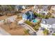 Breathtaking aerial view showcasing a charming home with a pool, outdoor dining area, and lush landscaping at 2975 Yachtsman Dr, Mount Pleasant, SC 29466