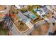 Aerial view of a blue home with palm trees, a pool, a patio, and a pergola at 2975 Yachtsman Dr, Mount Pleasant, SC 29466
