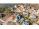 Aerial view of a neighborhood featuring a blue home with a pool, patio, and pergola at 2975 Yachtsman Dr, Mount Pleasant, SC 29466