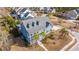 Aerial view of a blue home with palm trees and a front porch at 2975 Yachtsman Dr, Mount Pleasant, SC 29466