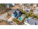 Aerial view of a neighborhood featuring a blue home with a pool, patio, and pergola at 2975 Yachtsman Dr, Mount Pleasant, SC 29466