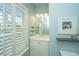 Bathroom features plantation shutters, a single vanity, and decorative accents at 2975 Yachtsman Dr, Mount Pleasant, SC 29466