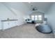 Spacious bedroom with a wet bar, beanbag chair, and serene natural lighting at 2975 Yachtsman Dr, Mount Pleasant, SC 29466