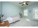 Bedroom features a ceiling fan, carpet, and a door to the outside at 2975 Yachtsman Dr, Mount Pleasant, SC 29466