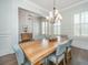 Dining room with live-edge wood table, six chairs, and view into the foyer at 2975 Yachtsman Dr, Mount Pleasant, SC 29466