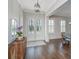 Bright foyer with hardwood floors, double doors, and view into the dining room at 2975 Yachtsman Dr, Mount Pleasant, SC 29466