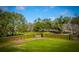 Expansive community lawn area with manicured green space, bench, and privacy hedges at 2975 Yachtsman Dr, Mount Pleasant, SC 29466