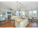 Granite island with seating that connects the living room and dining areas, perfect for gatherings at 2975 Yachtsman Dr, Mount Pleasant, SC 29466