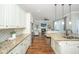 Gourmet kitchen with granite countertops, stainless steel appliances, and open view into a spacious living room at 2975 Yachtsman Dr, Mount Pleasant, SC 29466