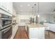 Bright kitchen with granite island, stainless steel appliances, and easy access to the living room for entertaining at 2975 Yachtsman Dr, Mount Pleasant, SC 29466