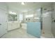 Bright main bathroom with bathtub and shower, offering a clean and modern design with ample natural light at 2975 Yachtsman Dr, Mount Pleasant, SC 29466
