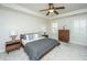 Comfortable main bedroom showcasing a ceiling fan, wood accents, shutters, and plush carpeting at 2975 Yachtsman Dr, Mount Pleasant, SC 29466