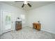 Bright office with a desk, shelving, plantation shutters, and a door leading outside at 2975 Yachtsman Dr, Mount Pleasant, SC 29466