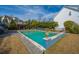 Backyard pool with a pergola, decorative rocks, grass, and a fence at 2975 Yachtsman Dr, Mount Pleasant, SC 29466