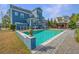 Inviting backyard pool area with outdoor kitchen, pergola, and beautiful stone patio at 2975 Yachtsman Dr, Mount Pleasant, SC 29466