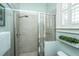 Tiled shower with seamless glass door, with shower head and a small glass shelf at 2975 Yachtsman Dr, Mount Pleasant, SC 29466