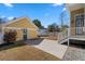 Spacious backyard featuring a patio area, detached garage, and lawn, perfect for outdoor activities and relaxation at 301 Forsythia Ave, Summerville, SC 29483
