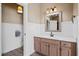 A bathroom featuring a single sink vanity, wainscoting and neutral color palette at 301 Forsythia Ave, Summerville, SC 29483