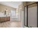 A spacious bathroom with a tub, glass doored shower, wood-look floor and a large window at 301 Forsythia Ave, Summerville, SC 29483