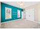 A bedroom features ample closet space, a ceiling fan, and natural light from the windows at 301 Forsythia Ave, Summerville, SC 29483