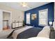 Stylishly decorated bedroom with plenty of natural light and closet space perfect for relaxation and organization at 301 Forsythia Ave, Summerville, SC 29483