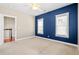 Spacious bedroom with natural light, closet, carpet flooring, ceiling fan, and light blue walls at 301 Forsythia Ave, Summerville, SC 29483