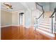 Inviting foyer with hardwood floors, curved staircase, and open access to the living spaces at 301 Forsythia Ave, Summerville, SC 29483