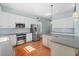 Bright kitchen with stainless steel appliances, white cabinets, and stone countertops at 301 Forsythia Ave, Summerville, SC 29483