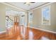 Open living room features hardwood floors, natural light, and views into the foyer and stairway at 301 Forsythia Ave, Summerville, SC 29483