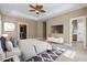 Main bedroom features tray ceilings, a ceiling fan, and an ensuite at 301 Forsythia Ave, Summerville, SC 29483