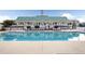A community pool with lounge chairs and a covered pavilion offers residents a relaxing outdoor space at 301 Forsythia Ave, Summerville, SC 29483