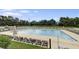 A large swimming pool with ample lounge chairs provides a perfect spot for relaxation and recreation at 301 Forsythia Ave, Summerville, SC 29483